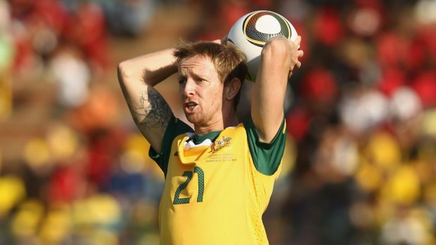 Australia's David Carney throws the Jabulani ball into play in 2010.