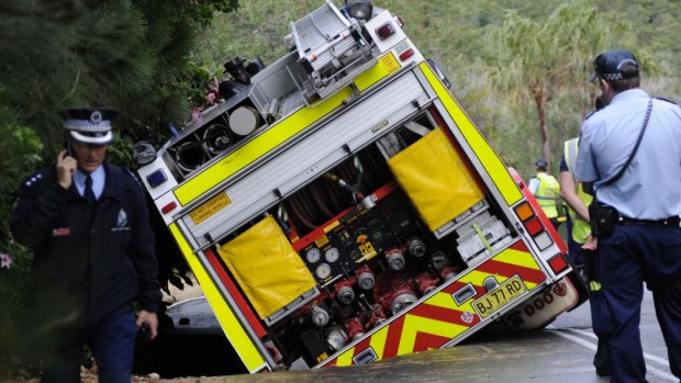 Ageing infrastructure: A fire truck sinks into a hole after a water main burst at Bilgola in Sydney's north.