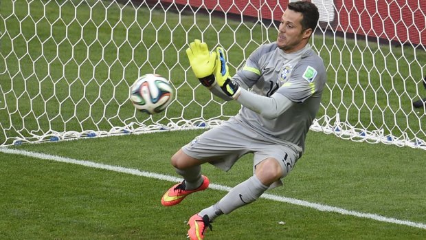 Brazil's goalkeeper Julio Cesar effects a save during the penalty shootout against Mexico.