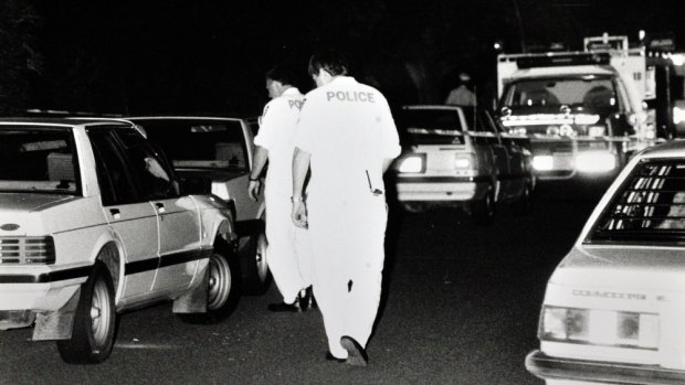 A police officers at the crime scene on the night Colin Winchester was murder.