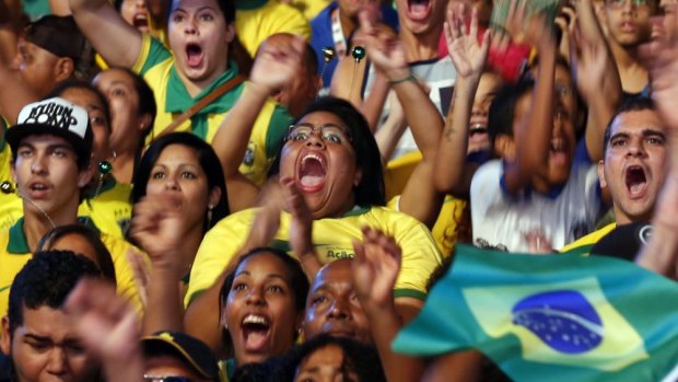 Futbol mad ... Brazilians celebrate after their team scores a goal against Croatia.