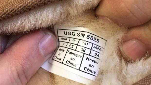 The 'Made in China' label on the interior of a pair of Deckers Corporation UGG Australia boots.