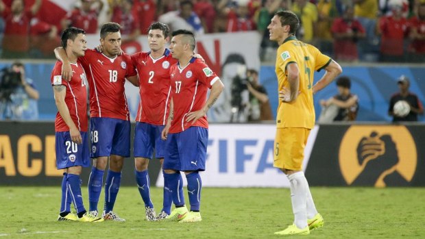 Relieved Chilean players gather after their win.