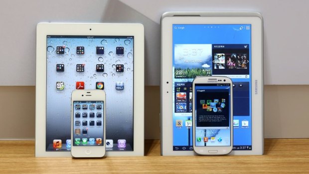 Copycat? Apple's iPad 2 and iPhone 4s, left, and Samsung's Galaxy Tab 10.1 and Galaxy S3.