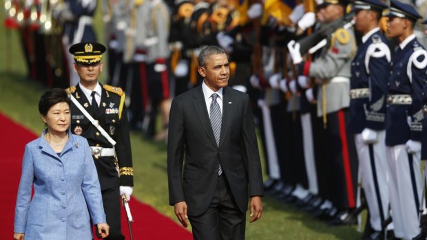 Barack Obama and Park Geun-hye inspect an honour guard at a welcoming ceremony at the presidential Blue House in Seoul.