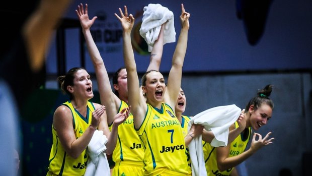 The Opals bench, led by Maddie Garrick (No.7), celebrate a three-pointer in their win over North Korea.