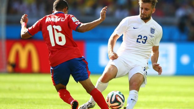 Christian Gamboa of Costa Rica and England’s Luke Shaw fight for a loose ball.