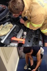 Firefighter Damian Christy frees the stressed cat.
