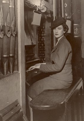 Connie Cloran as a young woman playing the organ.