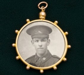 Nine carat gold photo locket with photo of a World War I soldier, photo of a woman on reverse, $1200.
