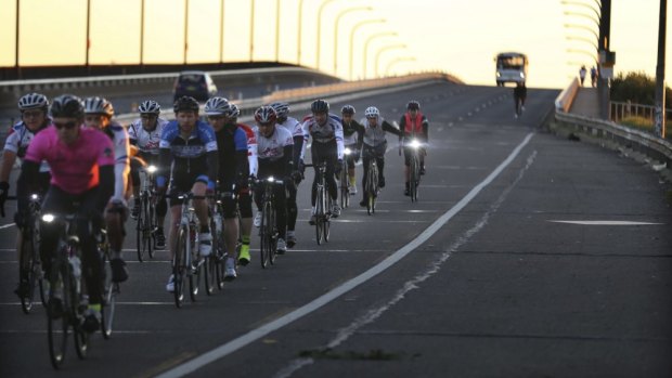 On the road: Cyclists south of the Captain Cook Bridge on Taren Point Road. 
