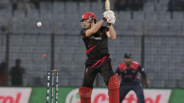 Hong Kong captain Jamie Atkinson is bowled out during their ICC Twenty20 Cricket World Cup qualifier