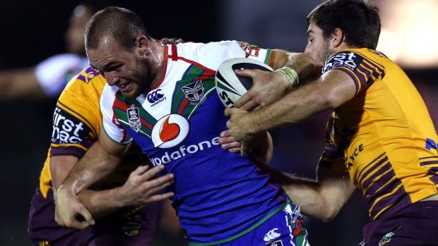 Simon Mannering tries to break the Brisbane line for the Warriors.