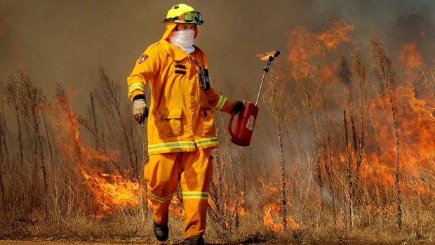 Backburning near the Canberra Equestrian Centre in 2012. Just 7 per cent of controlled burning was completed last fiscal year. 