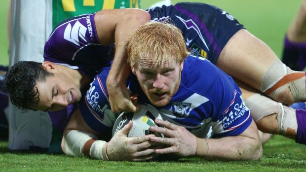 Under a cloud: Canterbury’s James Graham scores against Melbourne in his controversial round-four appearance after suffering a heavy hit. 