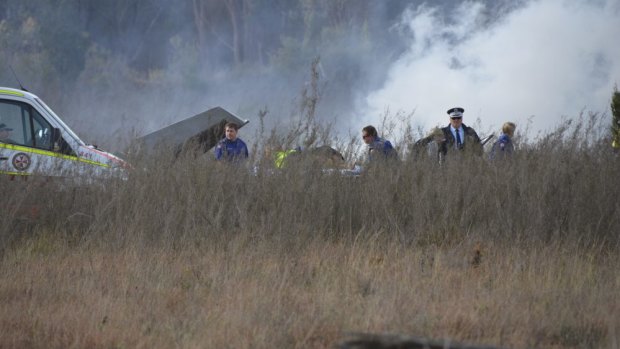 Smoke rises near the Inverell airport after a light plane crashed on Friday.
