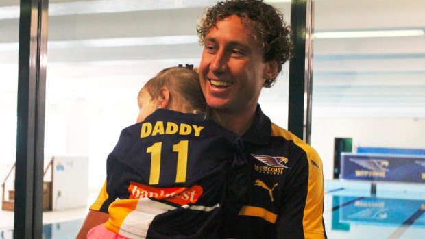 Priddis with his daughter after his press conference.