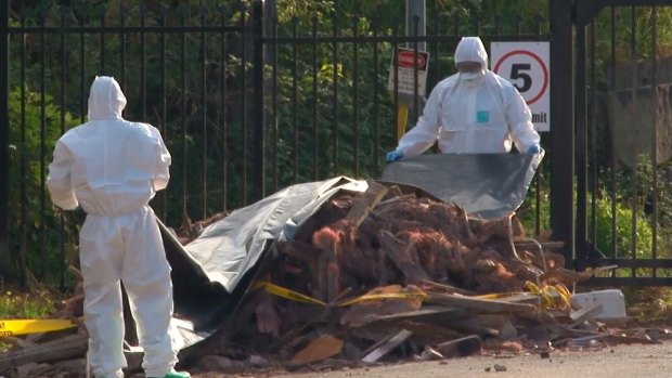 An emergency HAZMAT crew respond to dumped building material found on a Sydney suburban back street in May.