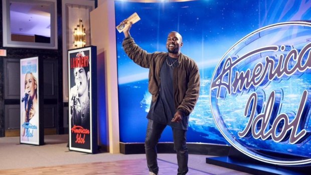 Kanye West with his 'ticket to Hollywood' after auditioning on <i>American Idol</i>.