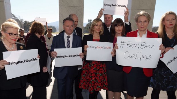 In more popular times: Australian Parliamentarians show solidarity with #bringbackourgirls signs in May. 