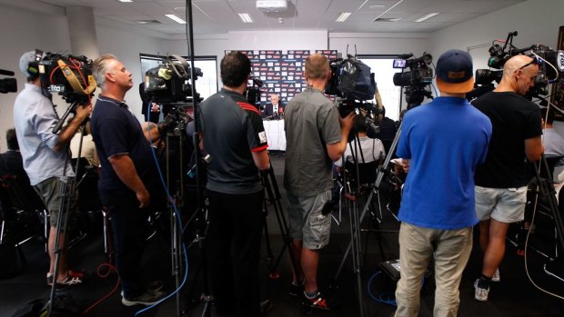 A large media pack looks on during Essendon chairman Paul Little's media conference in March.