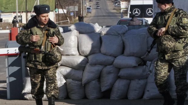 Ukrainian guards at a checkpoint at the border with Transnistria.