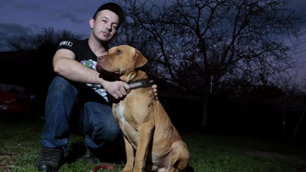Justen Storay from Griffith with his dog Laps in his backyard, Laps was sprayed with capsicum spray by an ACT police officer while on its chain.