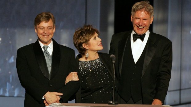 But they may look a little like this: Mark Hamill, Carrie Fisher and Harrison Ford pictured in 2005.