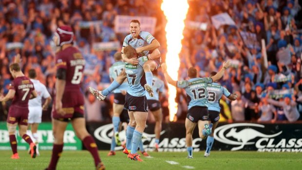 The Blues celebrate their 2014 State of Origin series win.