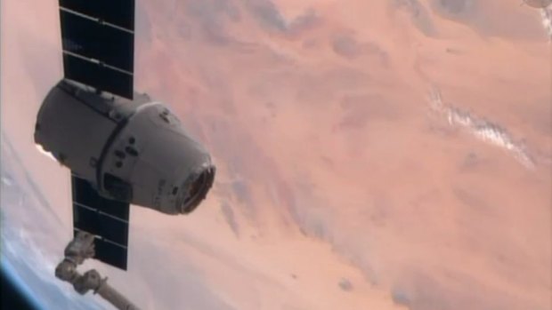 The SpaceX Dragon resupply capsule just prior to being captured by the Canadarm2 from the International Space Station.