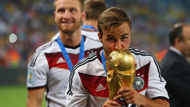 Bright future: Mario Goetze of Germany kisses the World Cup.