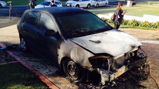 The torched car. 
