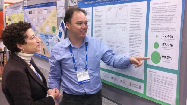 John Cook at a scientific conference in San Francisco explaining a 2013 consensus paper to Naomi Oreskes, who published a seminal work on scientific consensus.
