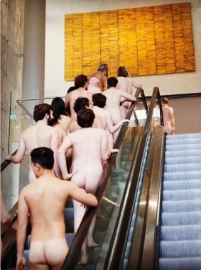 A naked tour group at the National Gallery of Australia heading into the James Turrell: A Retrospective tour on Wednesday night. 