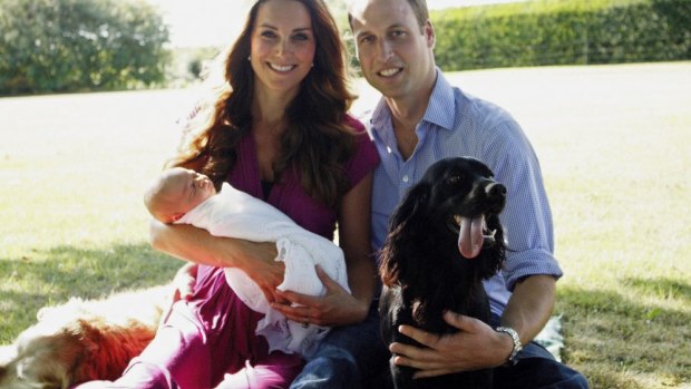 The Duke and Duchess of Cambridge with Prince George and Lupo the cocker spaniel, and Tilly the retriever (a Middleton family pet) during a visit to the Middleton residence in 2013.