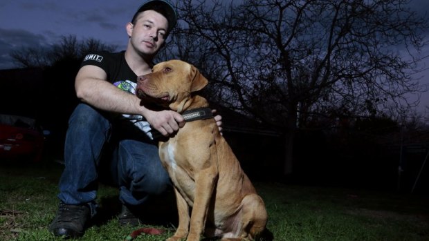 Justen Storay from Griffith with his dog Laps in his backyard. Laps was sprayed with capsicum spray by an ACT police officer while on a chain.