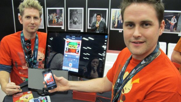 Joseph (L) and Sam Russell, brothers from Melbourne, Australia, show off their Jam smartphone app at the 2013 South by Southwest (SXSW) festival in Austin, Texas.