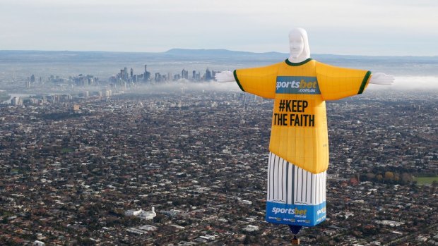 Hot air: the balloon in shape of Rio's Christ the Redeemer statue floats over Melbourne.