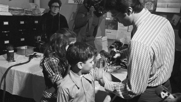 Doctors inoculate children to reduce the outbreak of measles in New Jersey in 1973.