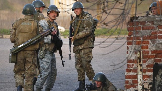 Ukrainian troops set up positions after seizing the air base near Kramatorsk in the country's east.