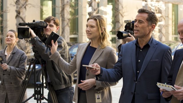 Anna Torv as Harriet Dunkley, centre, with Marcus Graham as Andrew Griffiths, right, in <i>Secret City</i>.  