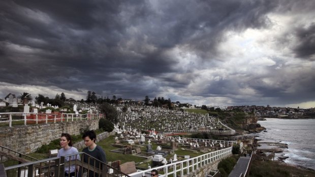 The storm front moves over Waverley Cemetery, Bronte, on Saturday afternoon.