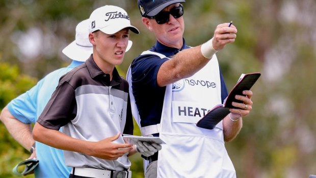 Thomas Heaton consults with his caddy.