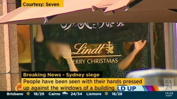 A screengrab apparently showing a jihadi flag being flown inside the Lindt Chocolat Cafe.
