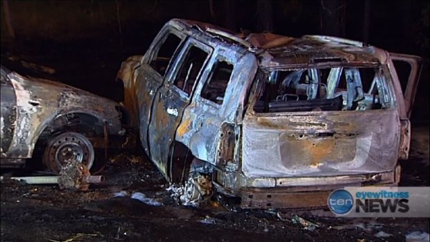 Police pulled four people from this 4WD before it burned.