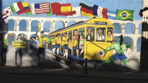 Premature celebration: A mural depicting Neymar holding the World Cup trophy on a wall in Santa Teresa, Rio de Janeiro.