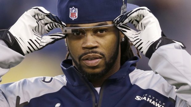 Google Glass is popping up everywhere: Seattle Seahawks' Sidney Rice adjusts his before the NFL Super Bowl XLVIII football final.