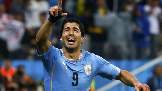 World class: Luis Suarez celebrates the winner against England.
