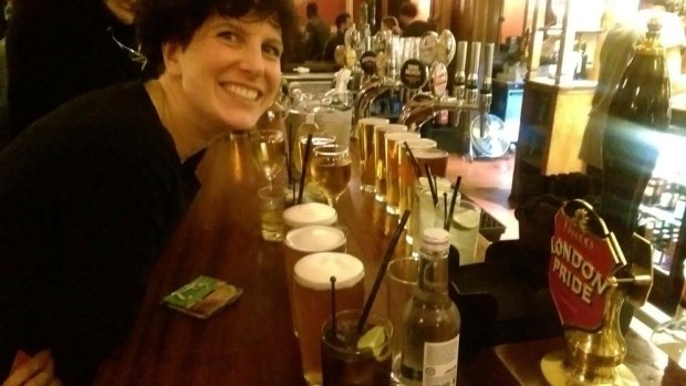 Michelle McGagh with the round of drinks she bought at the end of her no-spend year. 