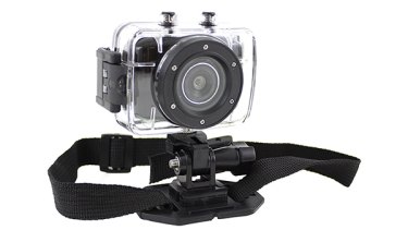 The action cam with helmet mount attached.